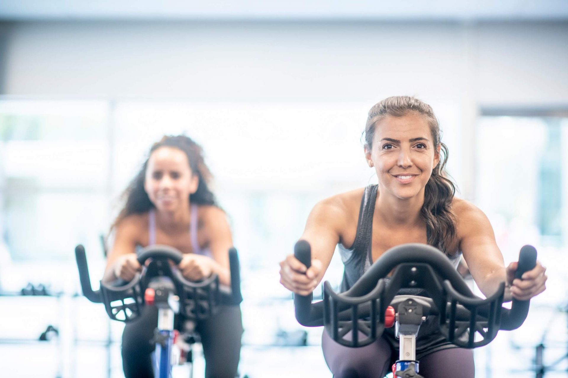 two women on spin bikes