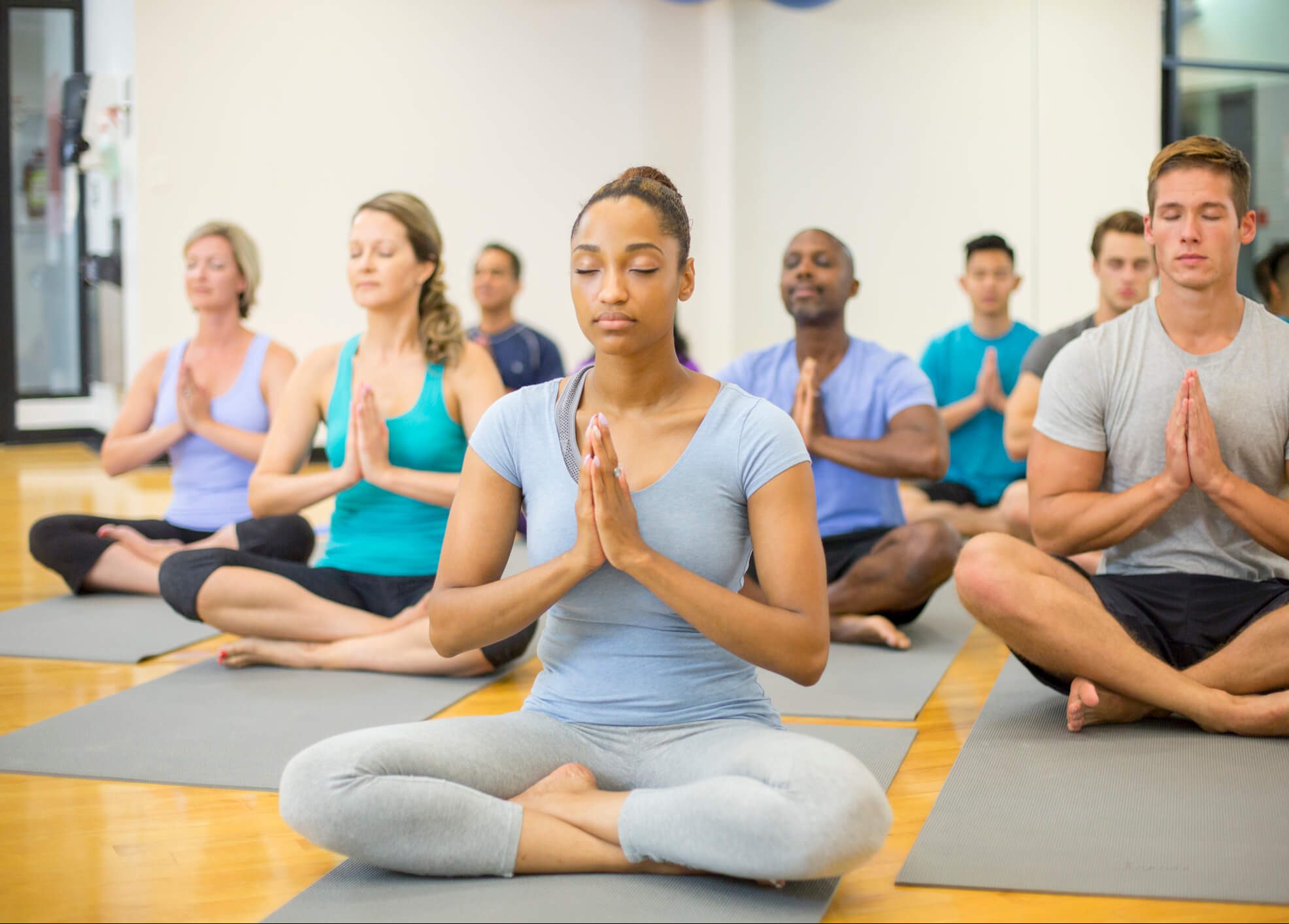 group of people in yoga class