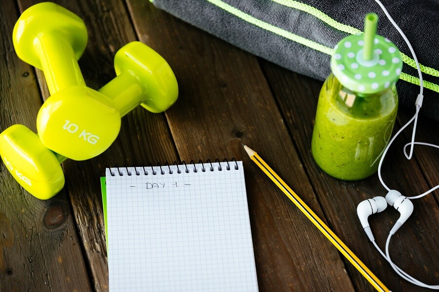 dumbells fitness journal and drink