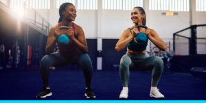 Two Women Doing Squats