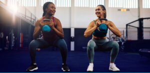 Two Women Doing Squats