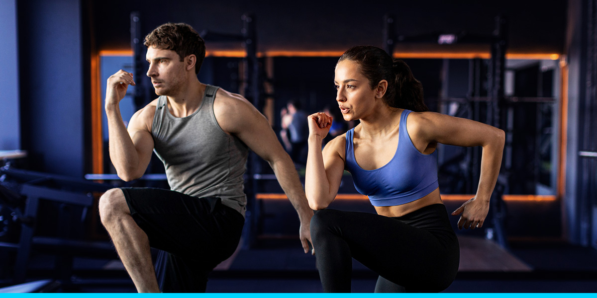 a man and a woman performing a lunge